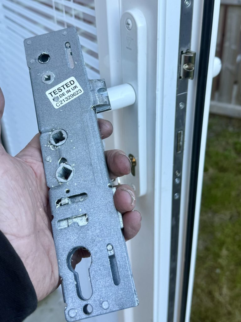 Failed multipoint lock gearbox removed from uPVC patio door in West Denton Newcastle showing cause of floppy door handle fault